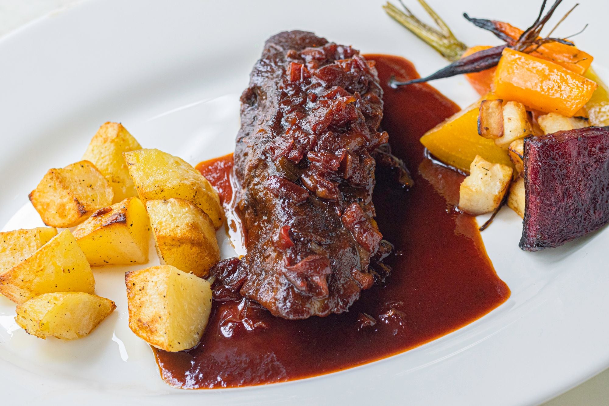 Roasted beef with potatoes and vegetables
