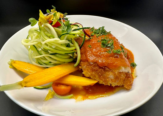Chicken Parmesan w/ Zucchini Noodles - A low-carb version of the classic Italian dish.