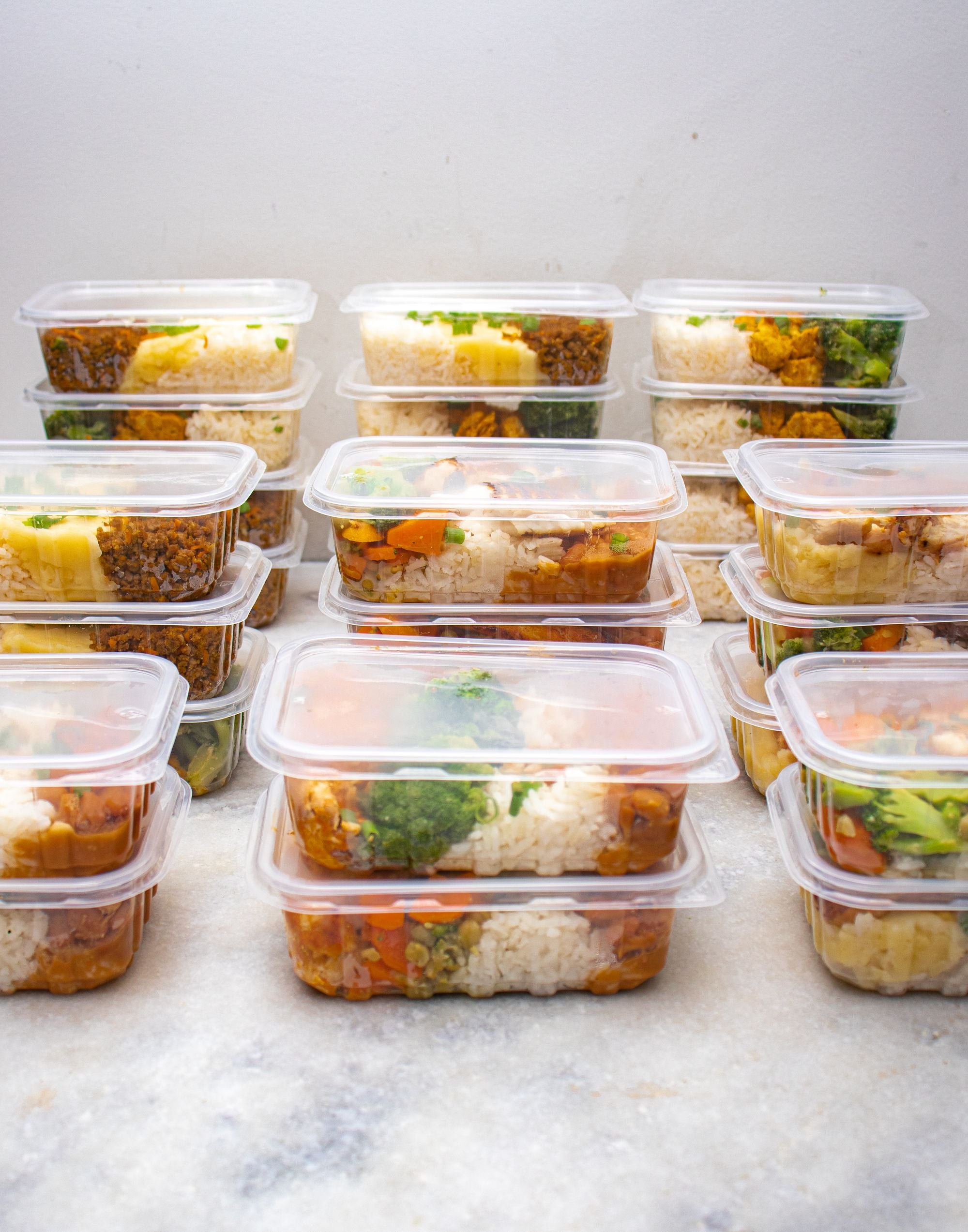 Meal preparation containers with rice and vegetables